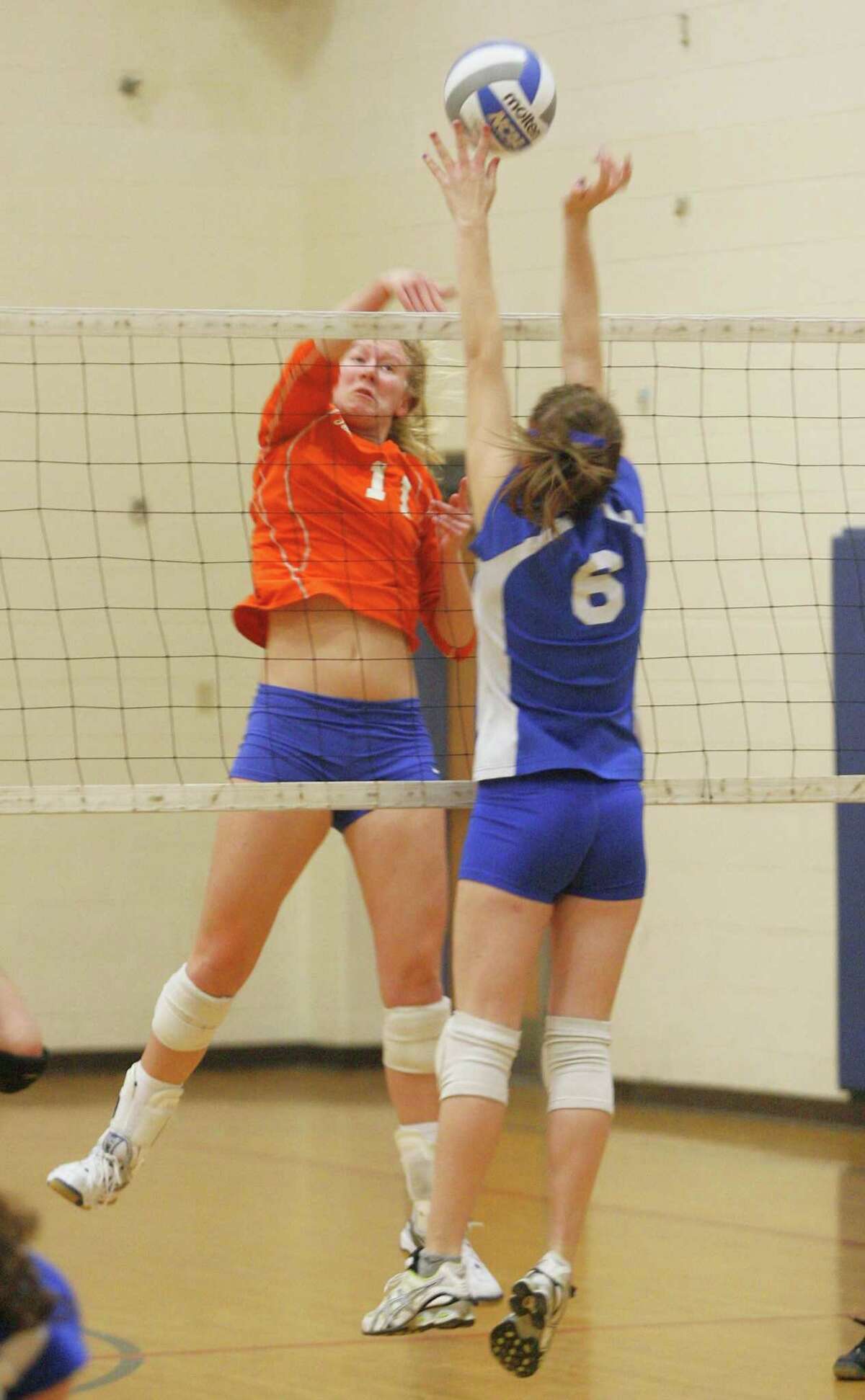 Dispatch Staff Photo by JOHN HAEGER twitter.com/oneidaphoto Oneida Paige Pendleton (11) has her shot blocked by Camden Ashlynn Hatton (6) in the first game of the match in Camden on Tuesday, Jan. 31, 2012.
