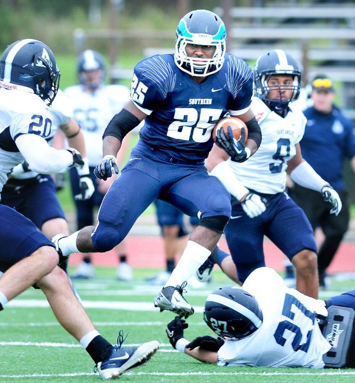 Vaughn Magee (center) of Southern runs through the St. Anselm defense in the first half on 9/29/2012.Photo by Arnold Gold/New Haven Register