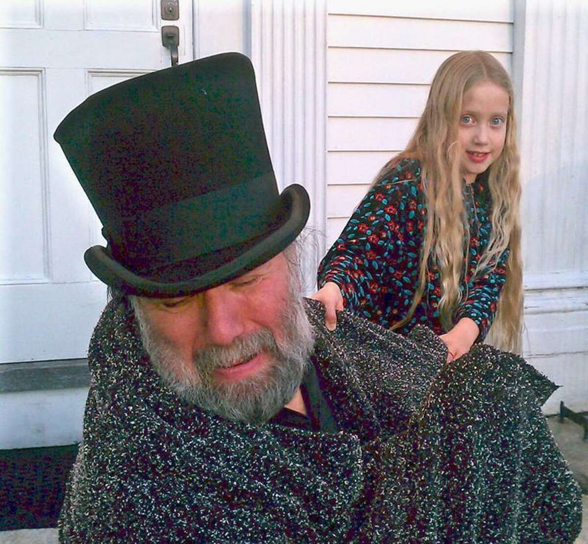 Contributed photo: Dana Sachs, left, as Ebenezer Scrooge, is pulled into the past by Spirit Emily May in "A Christmas Carol."