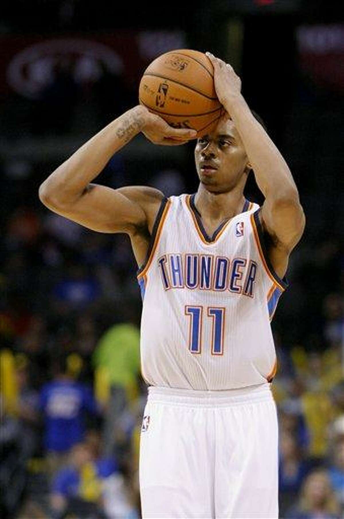 Oklahoma City Thunder shooting guard Jeremy Lamb (11) lines up his shot against the Toronto Raptors in the fourth quarter of an NBA basketball game in Oklahoma City, Tuesday, Nov. 6, 2012. Oklahoma City won 108-88. (AP Photo/Alonzo Adams)