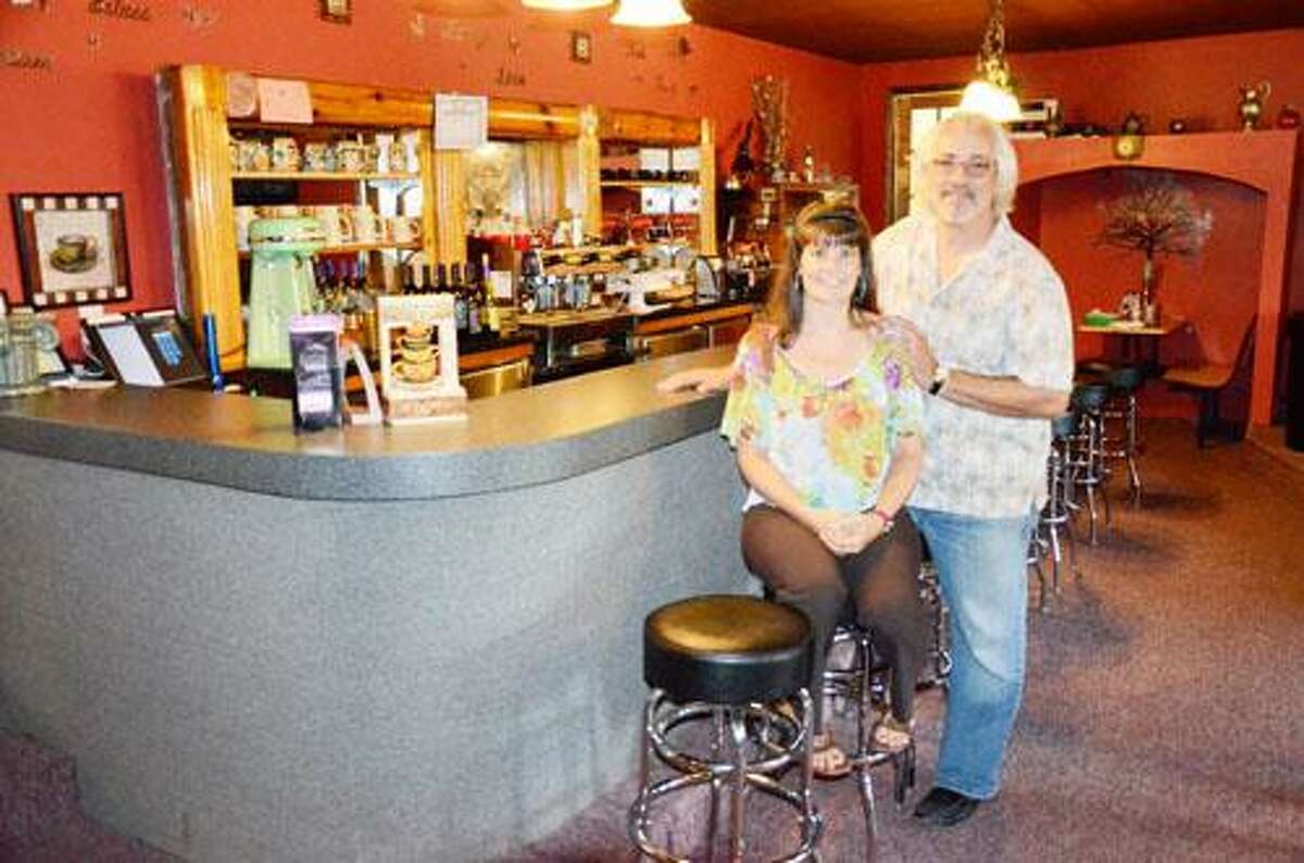 Dispatch Staff Photo by CAITLIN TRAYNOR Dave and Heidi Lupi sit at the bar in their restaurant, the Heid-ing Place Family Restaurant & He-Brews Coffee Cafe on the Canastota-Chittenango border.
