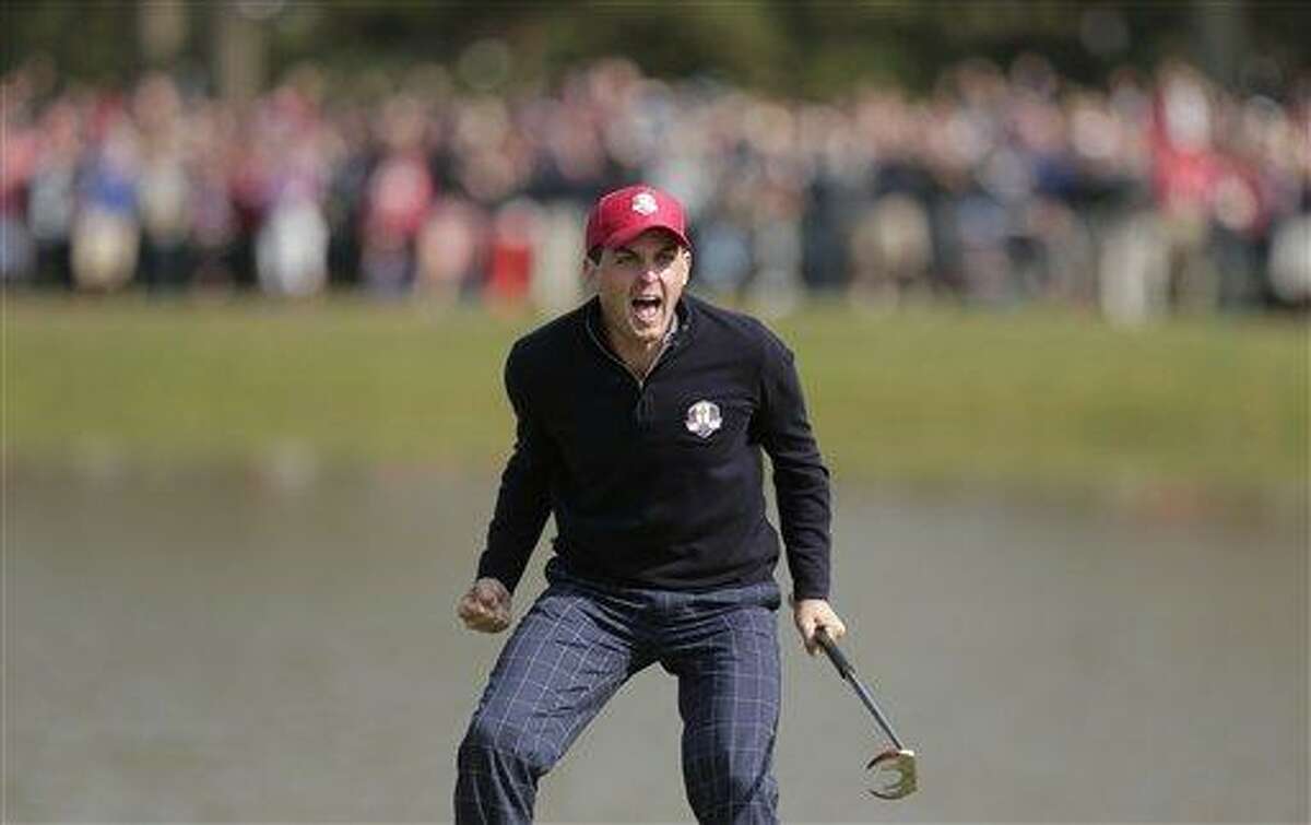 USA's Keegan Bradley celebrates after winning their foursomes match on the 15th hole at the Ryder Cup PGA golf tournament Friday, Sept. 28, 2012, at the Medinah Country Club in Medinah, Ill. (AP Photo/Charlie Riedel)