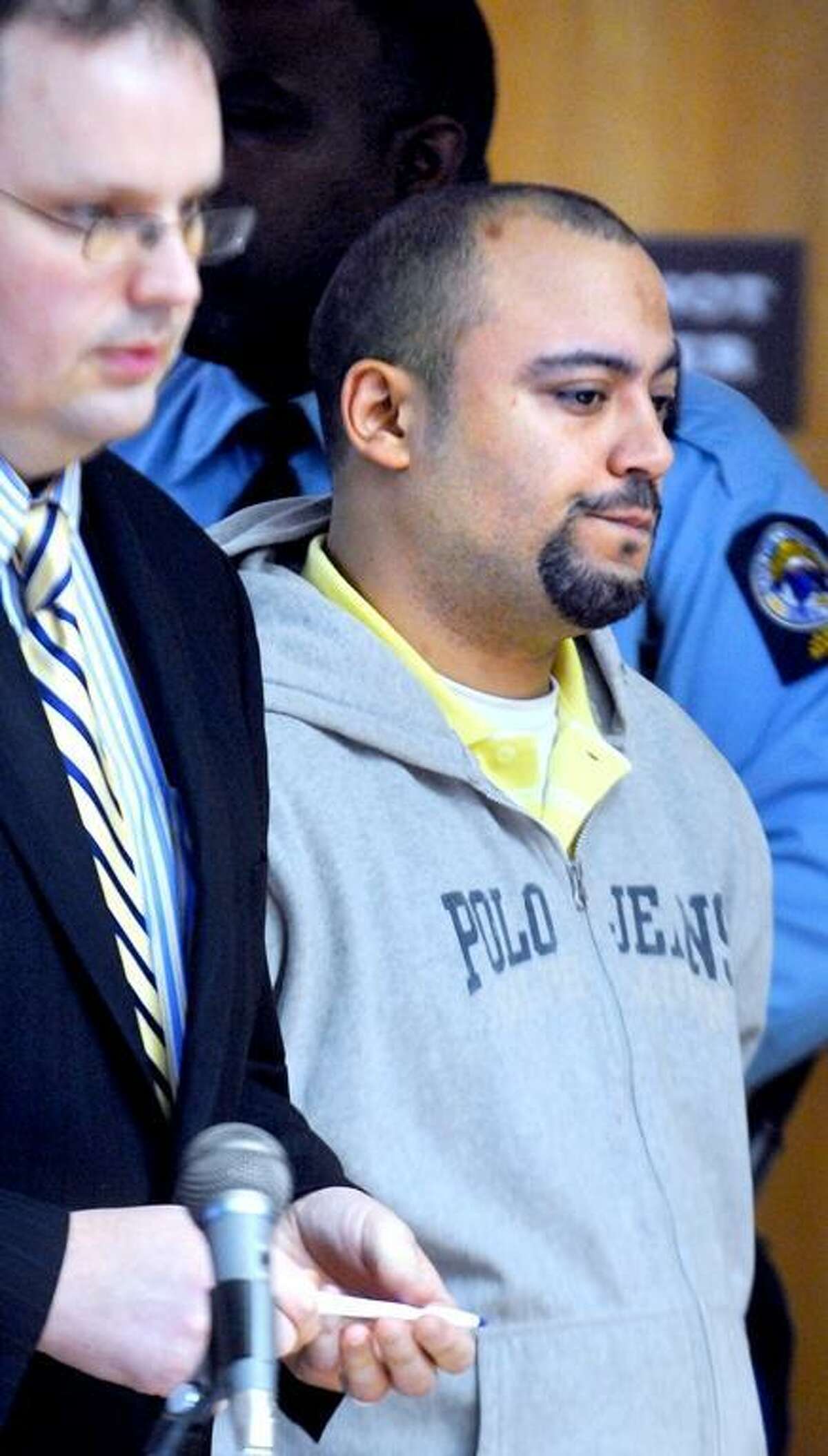 Angel Luis Santiago, right, is arraigned in December 2011 at Superior Court in Derby. Arnold Gold/Register file photo