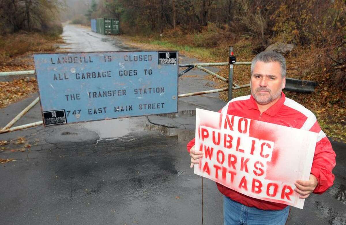 Ray Ingraham, Branford Republican party town chairman and a member of the RTM, is giving out signs protesting the placement of a new public works facility on a town owned property on Tabor Drive in Branford Tuesday, November 27, 2012. Ingraham is also circulating a petition protesting the project. Residents are also asking the Board of Finance not to fun the project at the site. Photo by Peter Hvizdak / New Haven Register