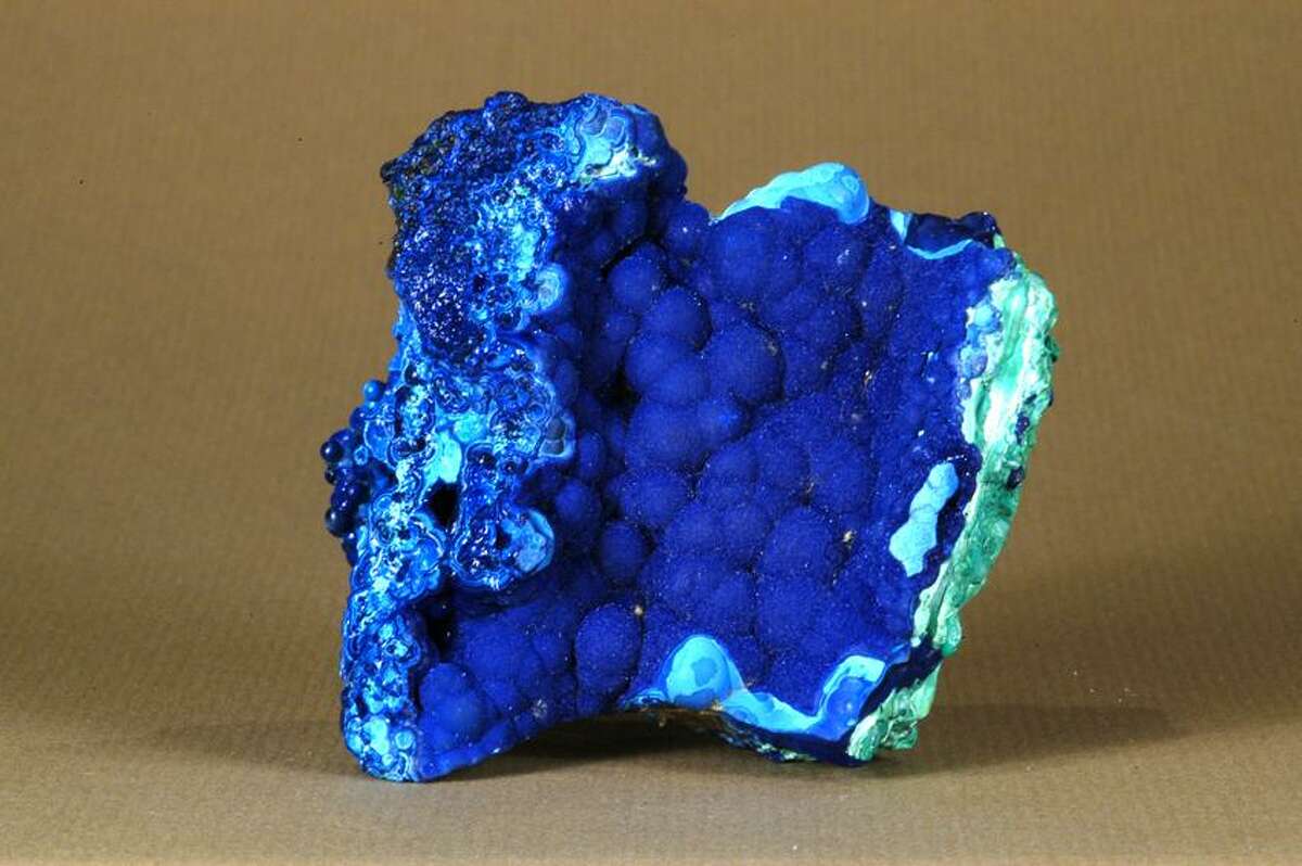 Blue azurite, a form of copper, was found at Bisbe, Ariz., a site now closed to collecting. Rhodochrosite is a pink mineral found in Argentina. This is actually a piece of stalactite, and that's why it contains rings, says Bob Daniels of the New Haven Mineral Club. These minerals sell for about $600 each, he adds.
