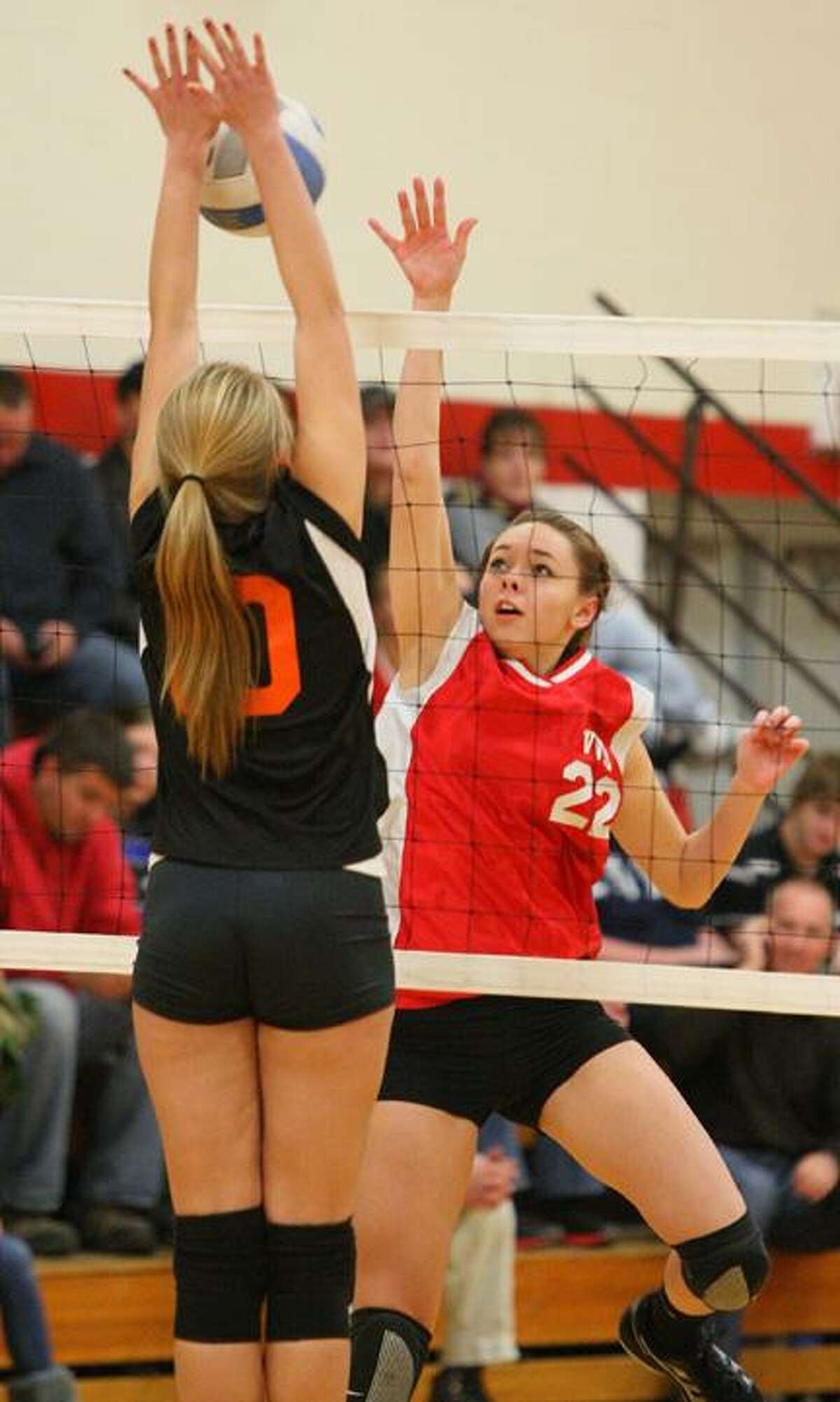 Dispatch Staff Photo by JOHN HAEGER (Twitter: @OneidaPhoto) VVS' Emily Brown (22) has her shot blocked by RFA's Allaina Johnson (10) in the first game of the match on Wednesday at VVS. The Red Devils won the match 3-0.