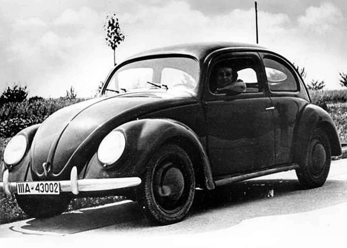 This is a front view of a Volkswagen automobile in Germany in Aug. 1938. The people's car, also called "Kraft durch Freudewagen," Strength through Joy, is manufactured by the German Labor Front, a Nazi organization. The mass produced, low-priced car will cost 1000 deutsche marks, approximately $250 US. The model runs 35 miles on the gallon and 60,000 miles without the need of repairs. (AP Photo/German Railroads Information Office)