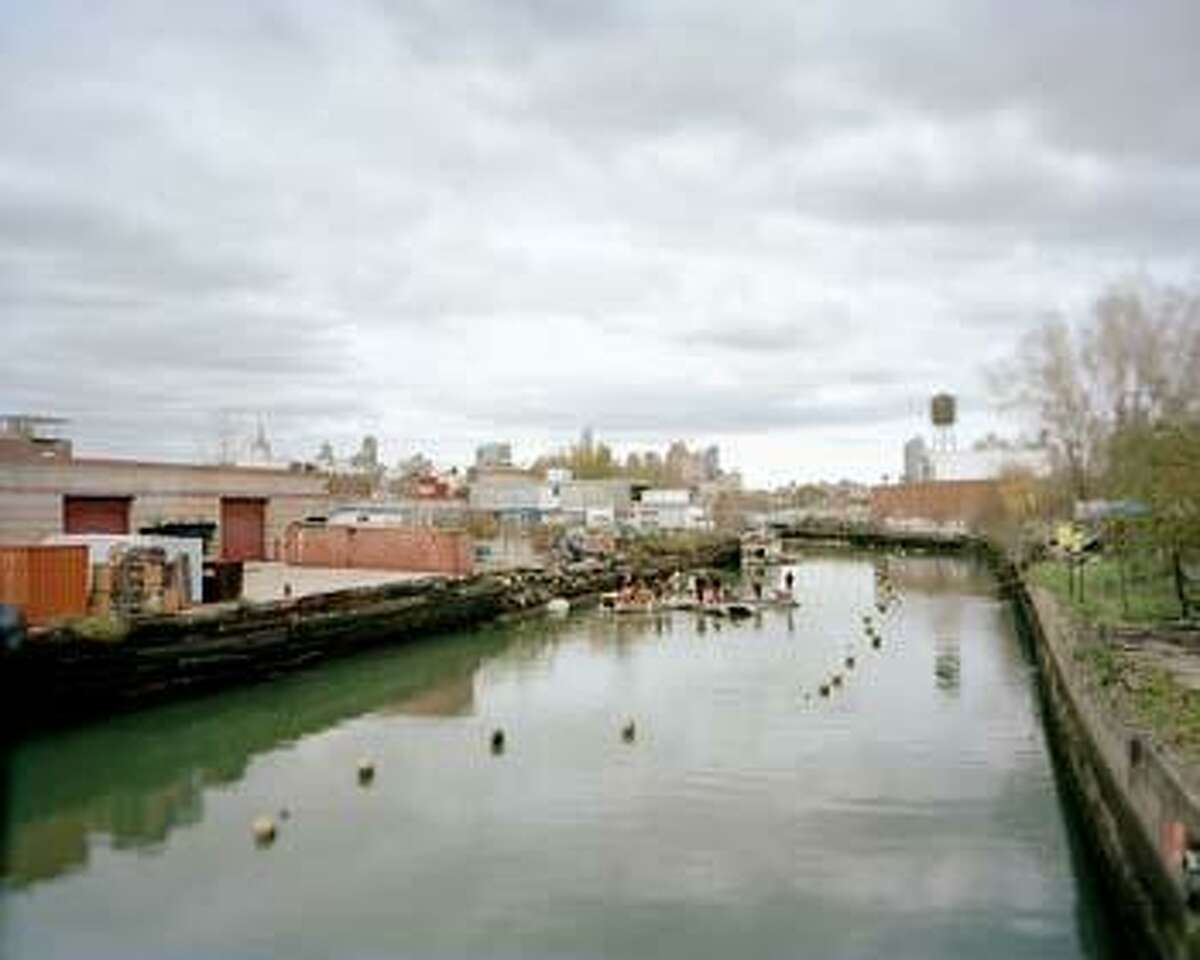 A photograph of the Gowanus Canal by Brooker Singer; part of an exhibit of her photographs of Superfund sites at The Tremaine Gallery at The Hotchkiss School in Salisbury.