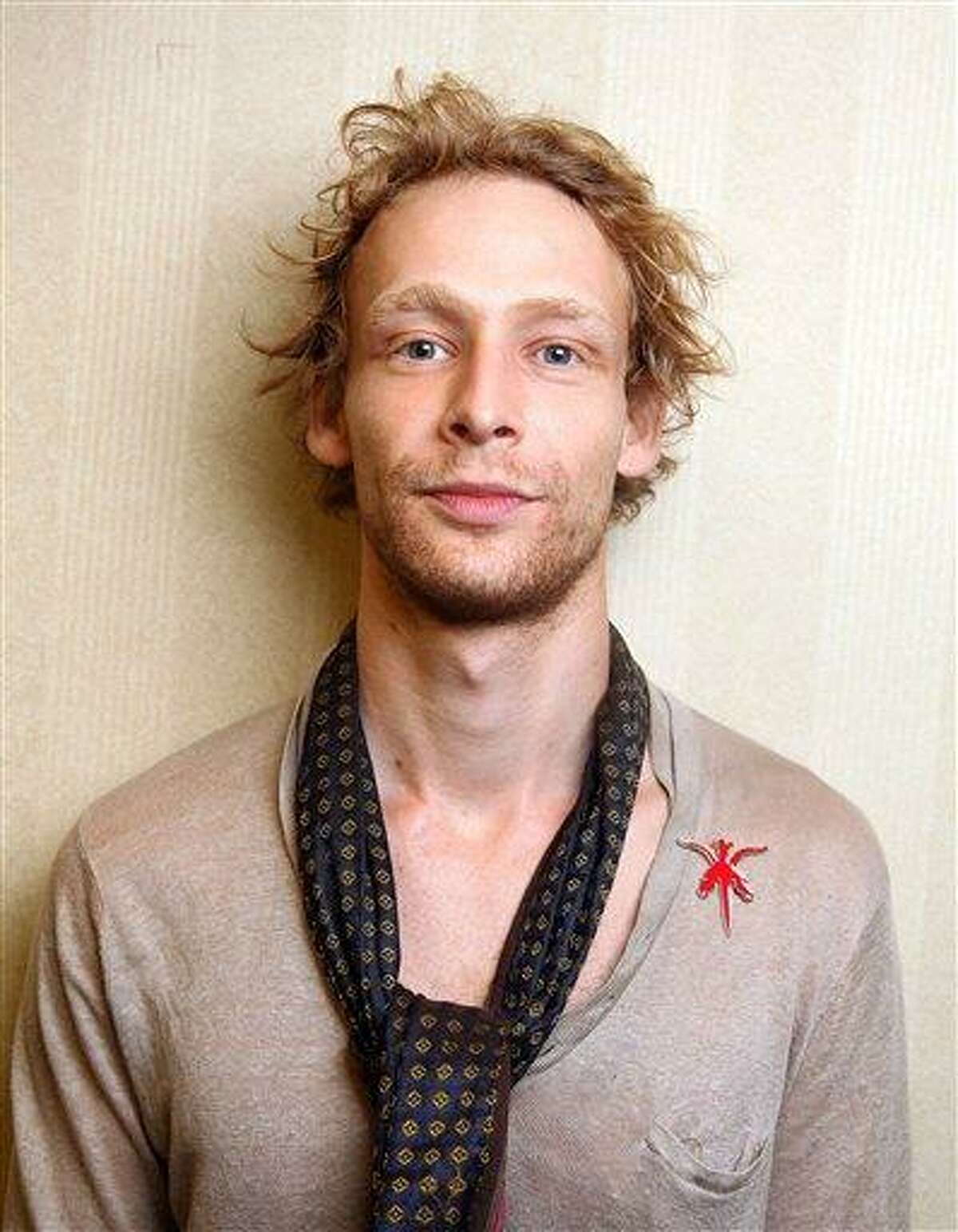 This 2011 file photo shows actor Johnny Lewis posing for a portrait during the 36th Toronto International Film Festival in Toronto, Canada. Authorities say Lewis fell to his death after killing an elderly Los Angeles woman. Lewis appeared in the FX television show "Sons of Anarchy" for two seasons. Associated Press