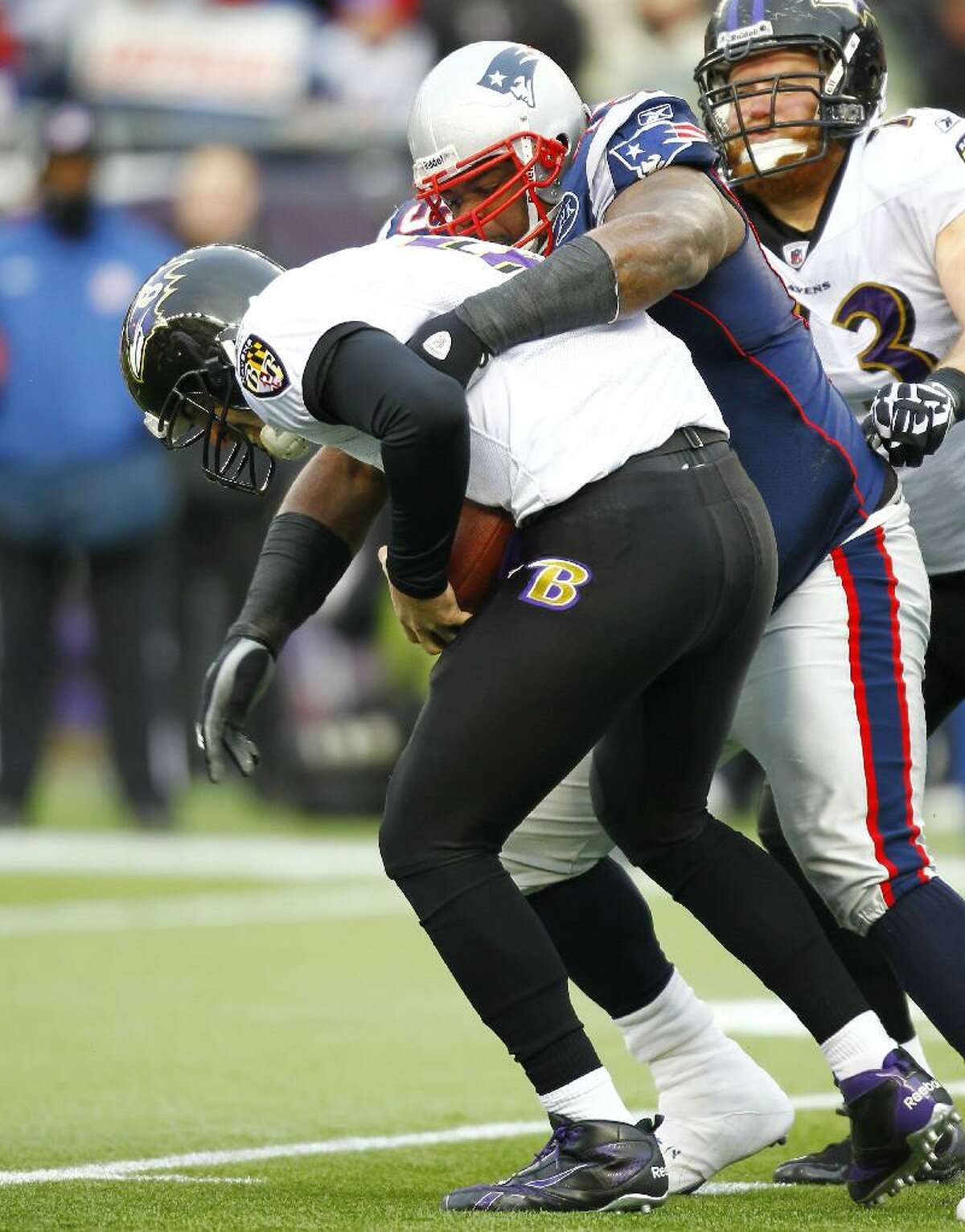 ASSOCIATED PRESS New England Patriots defensive end Vince Wilfork (75) sacks Baltimore Ravens quarterback Joe Flacco (5) during the AFC championship game on Jan. 22 at Gillette Stadium in Foxborough, Mass. Wilfork is not easy to move out of the middle of the Patriots' defense.