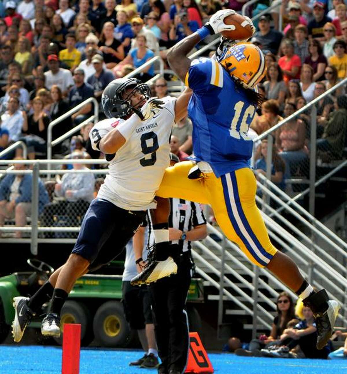 Tight end Kameel Lashley of the University of New Haven pulls in a touchdown pass against Sam Walker of St. Anselm College during second quarter football action at the University of New Haven Saturday, September 22, 2012Photo by Peter Hvizdak / New Haven Register