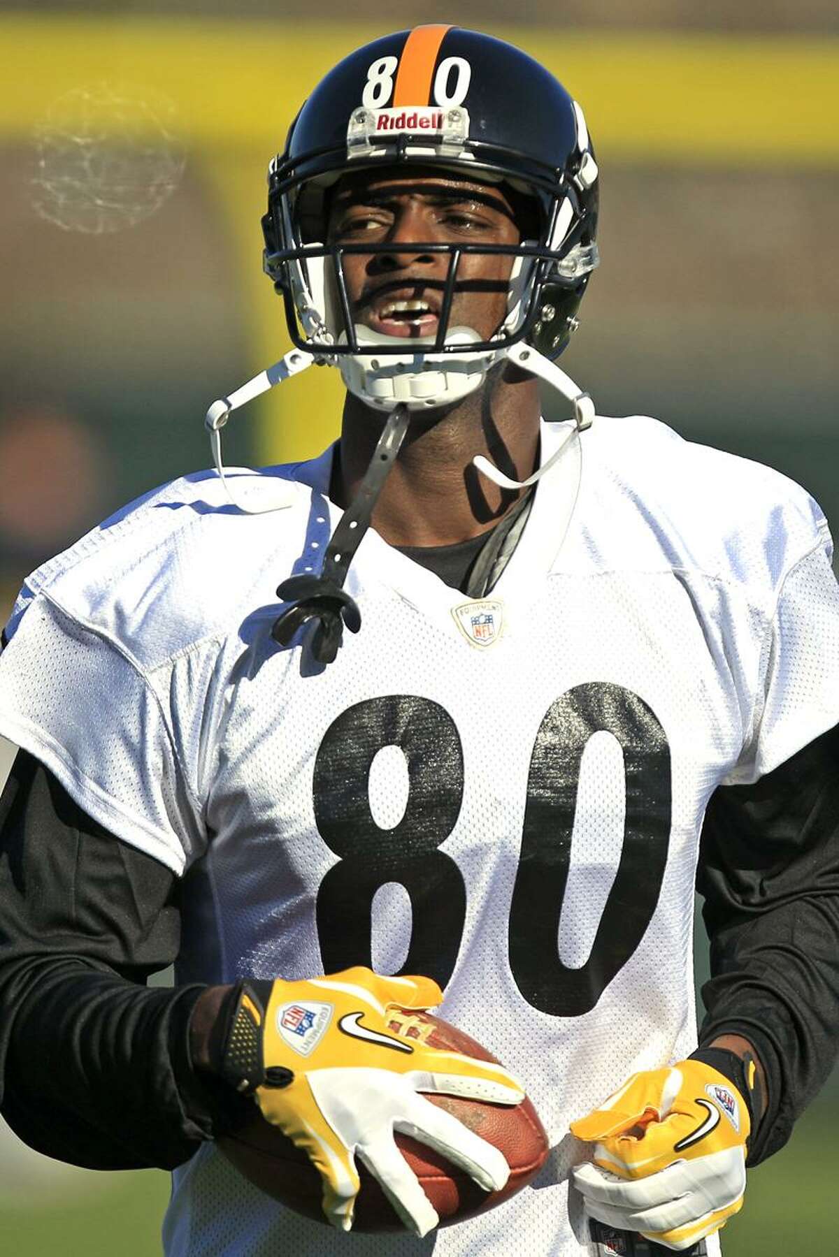Newly signed Pittsburgh Steelers wide receiver Plaxico Burress (80) runs a drill during NFL football practice, Wednesday, Nov. 21, 2012, in Pittsburgh. Burress returned to the team that drafted him a dozen years ago on Wednesday hungry, humble and eager to prove there's still some life left in a career that's never quite lived up to his own outsized expectations. (AP Photo/Gene J. Puskar)
