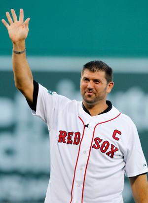 Boston Red Sox pitching coach John Farrell (C) and catcher Jason