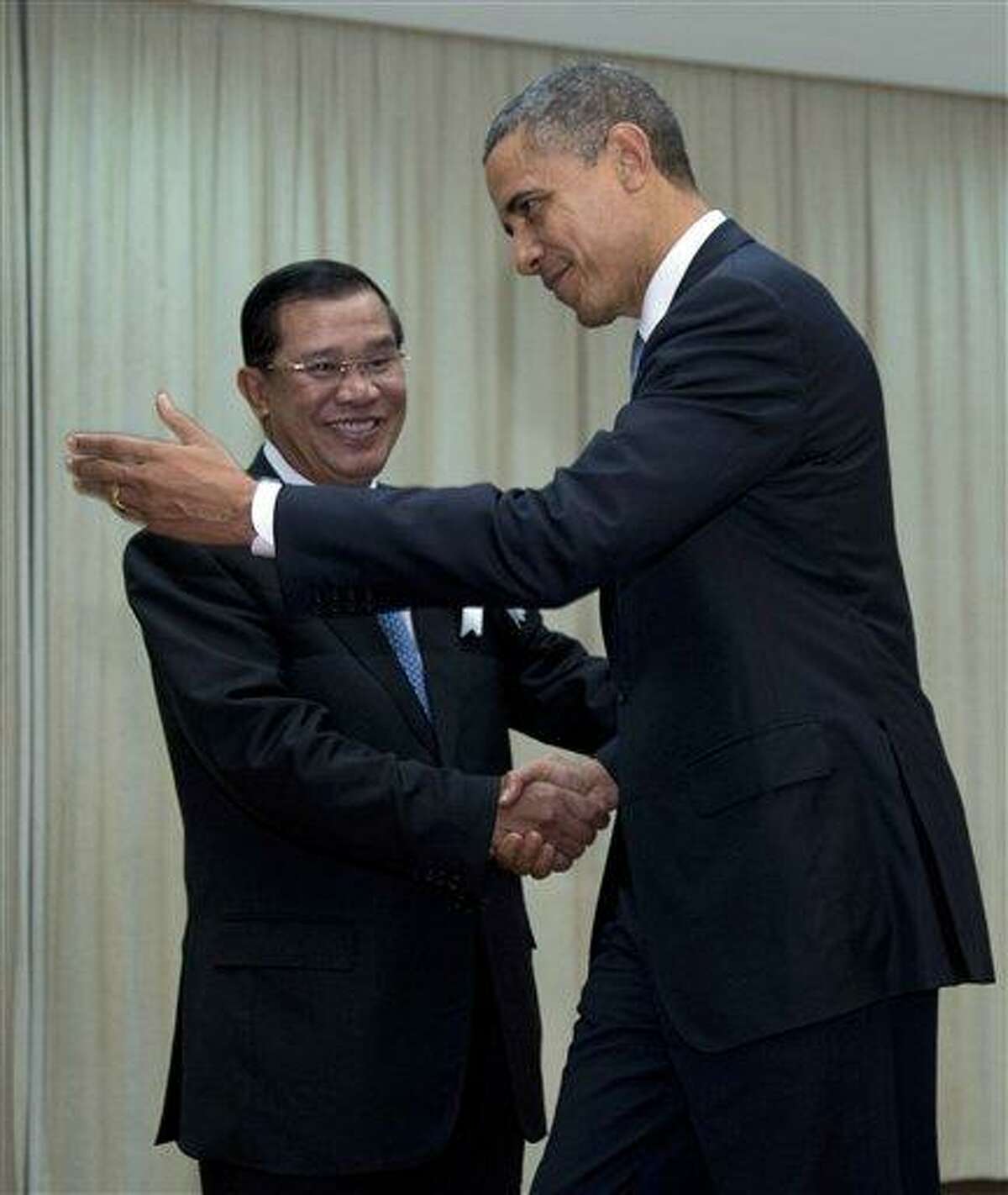U.S. President Barack Obama is welcomed by Cambodia's Prime Minister Hun Sen as he arrives at the Peace Palace in Phnom Penh, Cambodia, Monday. Obama will attend the East Asia Summit. AP Photo/Carolyn Kaster