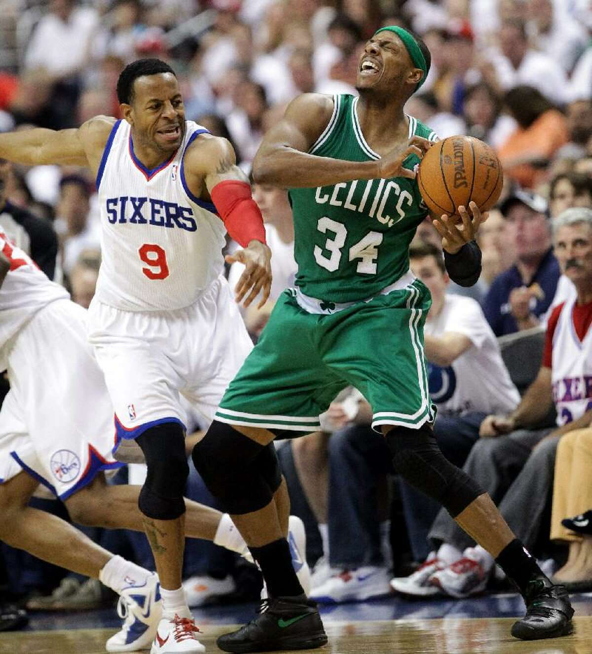 ASSOCIATED PRESS 76ers forward Andre Iguodala smacks across the face of Celtics forward Paul Pierce during Game 3 of their Eastern Conference semifinal series. The teams meet in Game 5 on Monday in Boston.