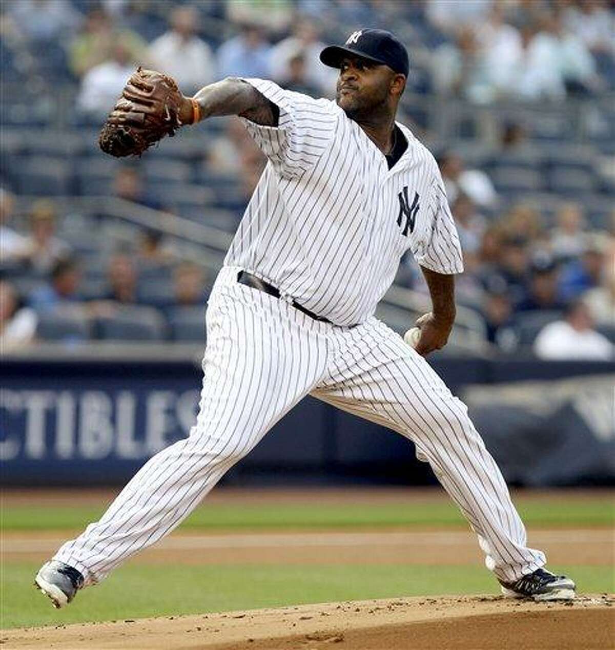 New York Yankees starting pitcher CC Sabathia delivers in the