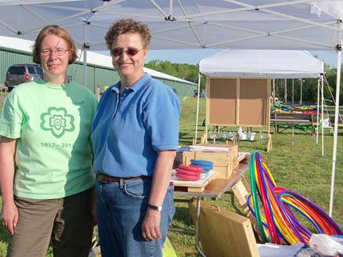Jonetta Badillo I The Middletown Press Linda Kalish, right, director of program, and Janet Ridenour, senior director of program services, are at the Durham Fairgrounds Friday preparing for the Girl Scout Jubilee that will take place Saturday in honor of the Girl Scouts' 100th anniversary. Watch the video at middletownpress.com.