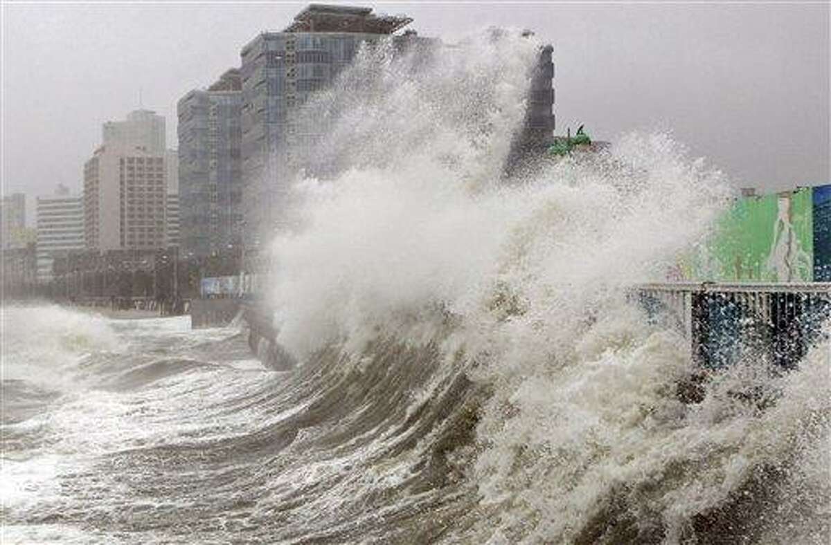 High waves caused by Typhoon Sanba crash on Haeundae beach Monday in Busan, south of Seoul, South Korea. Associated Press
