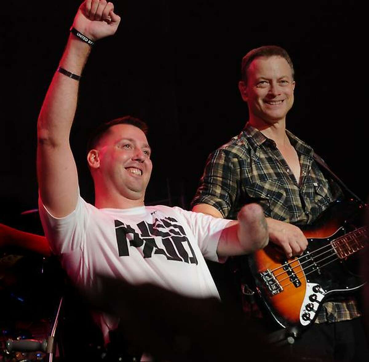 Gary Sinise, right, with veteran Adam Keys, left, at the benefit concert at State Theater in Easton, Penn. Photo by Melanie Stengel/New Haven Register