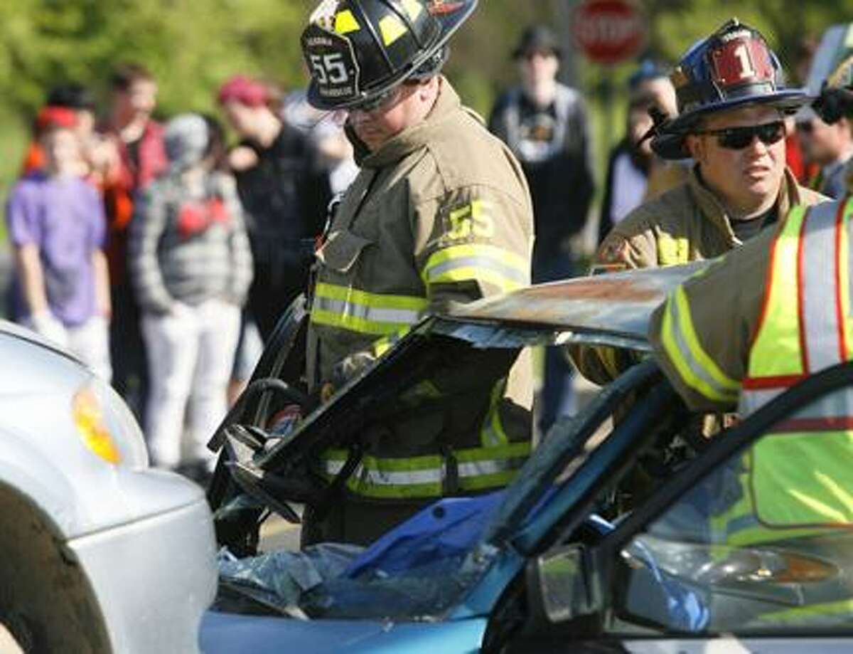 Dispatch Staff Photo by JOHN HAEGER (Twitter.com/OneidaPhoto)Members of the Verona and Sherrill Kenwood Fire Departments work to remove victims from vehicles as members of the VVS junior class look on during a mock DWI accident at VVS High School on Thursday, May 17, 2012.