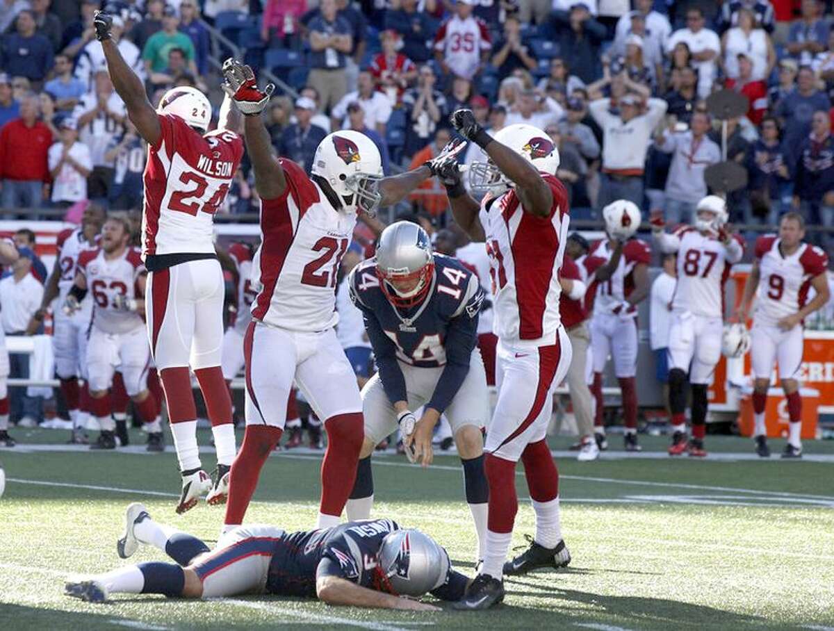 Sep 16, 2012; Foxborough, MA, USA; The Arizona Cardinals celebrate as New England Patriots kicker Stephen Gostkowski (3) lays on the ground after missing a field goal in the last seconds of play during the second half at Gillette Stadium. The Arizona Cardinals defeated the New England Patriots 20-18. Mandatory Credit: David Butler II-US PRESSWIRE