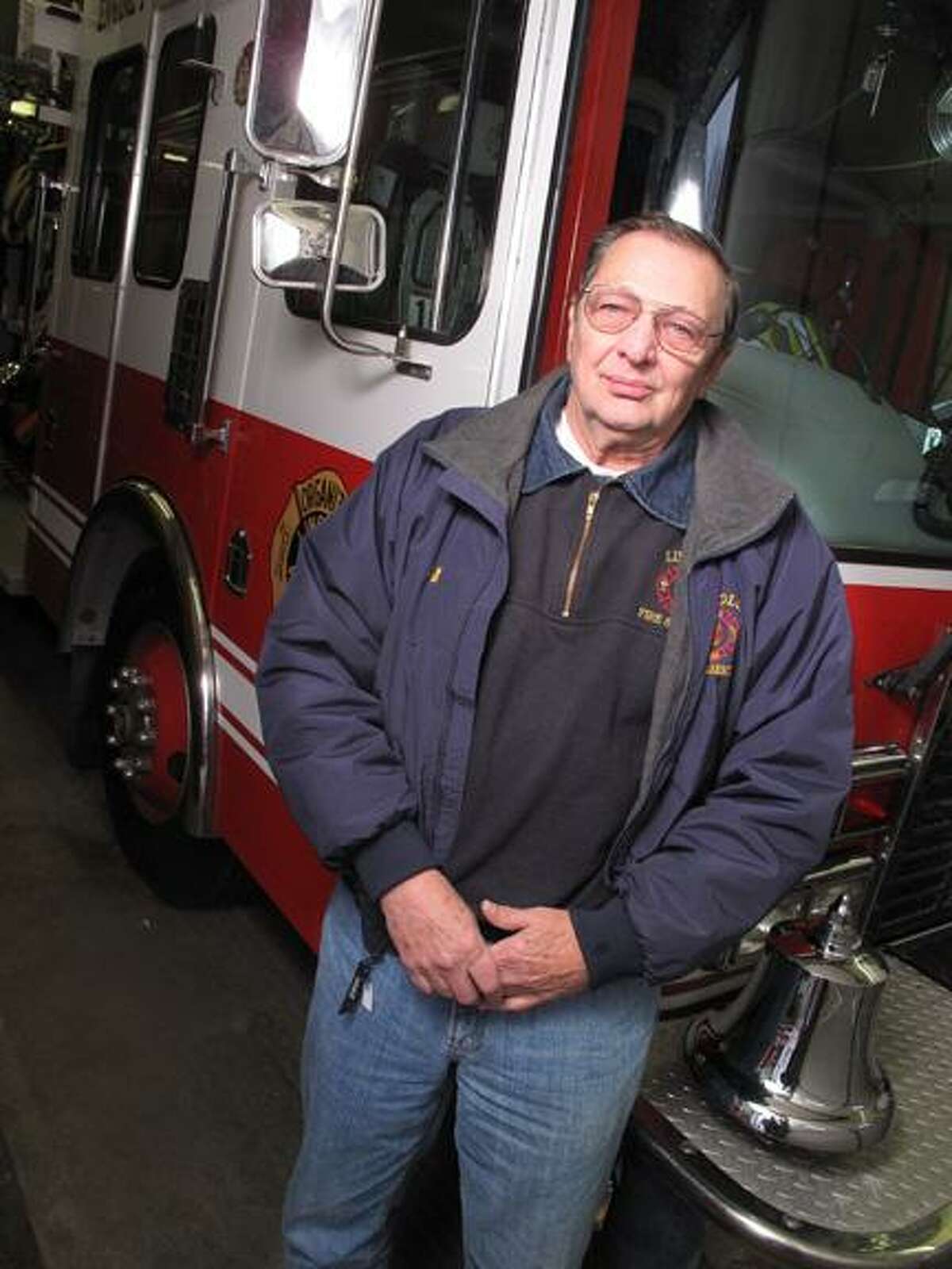 Dispatch Staff Photo by JOHN HAEGER (Twitter.com/OneidaPhoto)William Sweatman poses next to one of the Lincoln Fire Department trucks on Tuesday, Jan. 17, 2012 at the station in Lincoln.