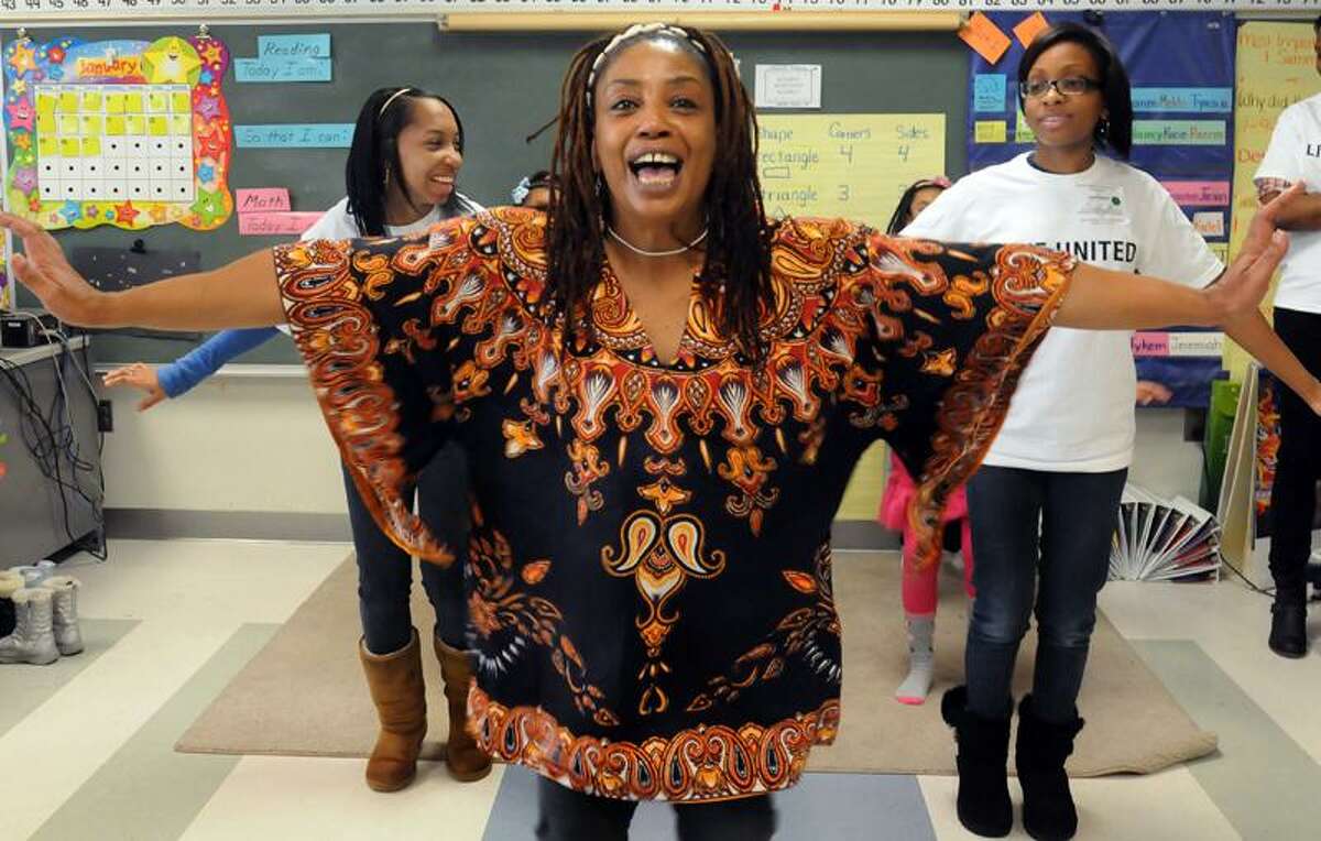Shari Caldwell teaches African dance steps during the Character Over Color Conference at Wexler-Grant Community School in New Haven. Melanie Stengel/Register