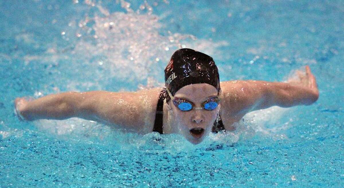 Branford's Paige MacNeil on the butterfly leg of the 200 medley relay final heat. Branford won the event and the meet. Photo--Peter Casolino/New Haven Register.