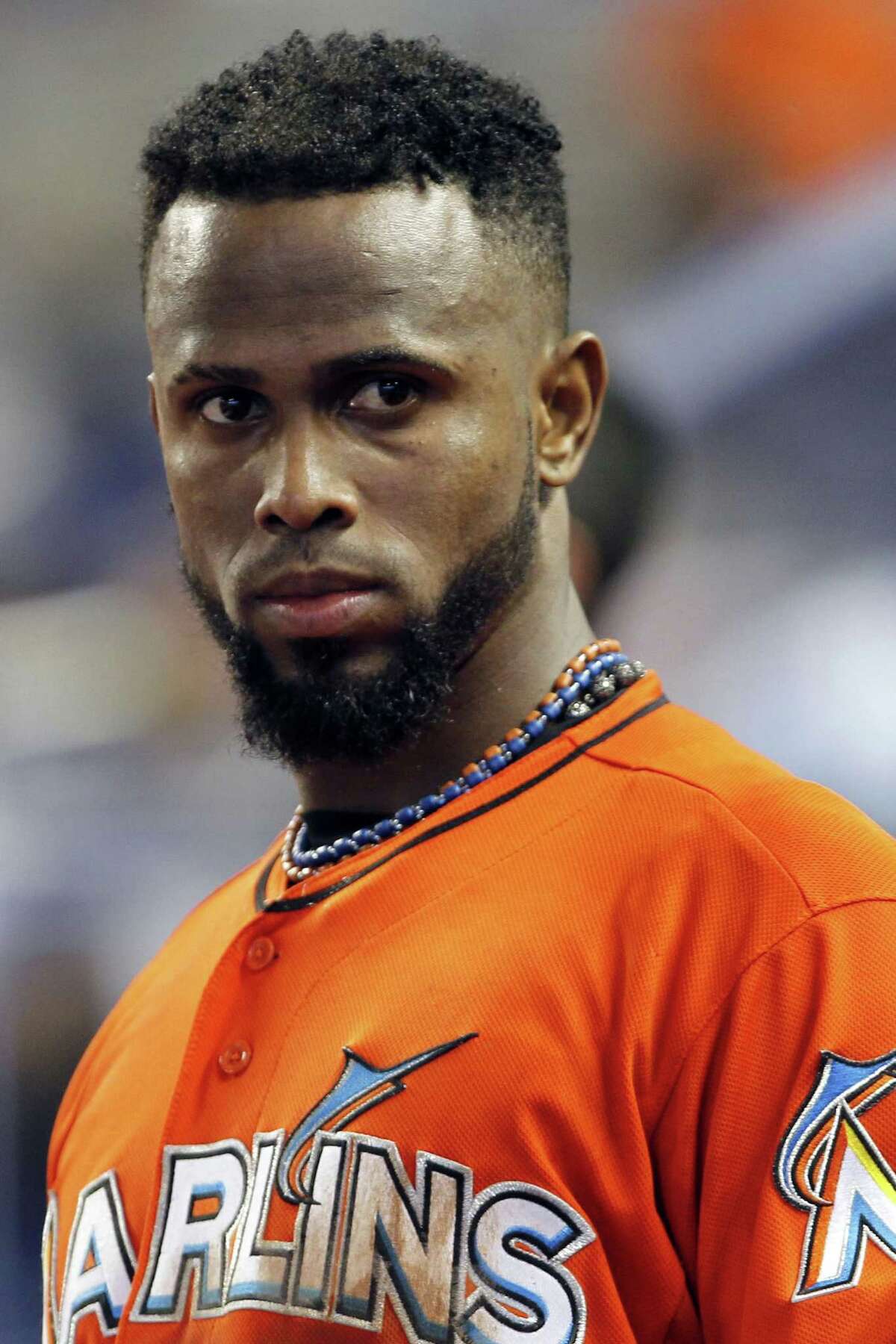 FILE - In this Sept. 2, 2012, file photo, Miami Marlins shortstop Jose Reyes appears in the dugout during a baseball game against the New York Mets in Miami. A person familiar with the deal told The Associated Press on condition of anonymity Tuesday, Nov. 13, that the Marlins have traded Reyes to the Toronto Blue Jays. (AP Photo/Alan Diaz, File)