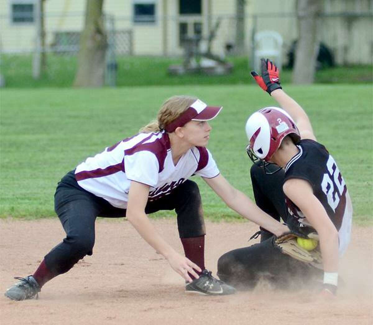 Dispatch Staff Photo by DAVID M. JOHNSONCanastotaÕs Sam McCarthy, left, tags out Sherburne-EarlvilleÕs Kayla Nelson as she tries to steal second base in a CSC contest in Canastota on Monday, May 14, 2012. The game was not reported by press time.
