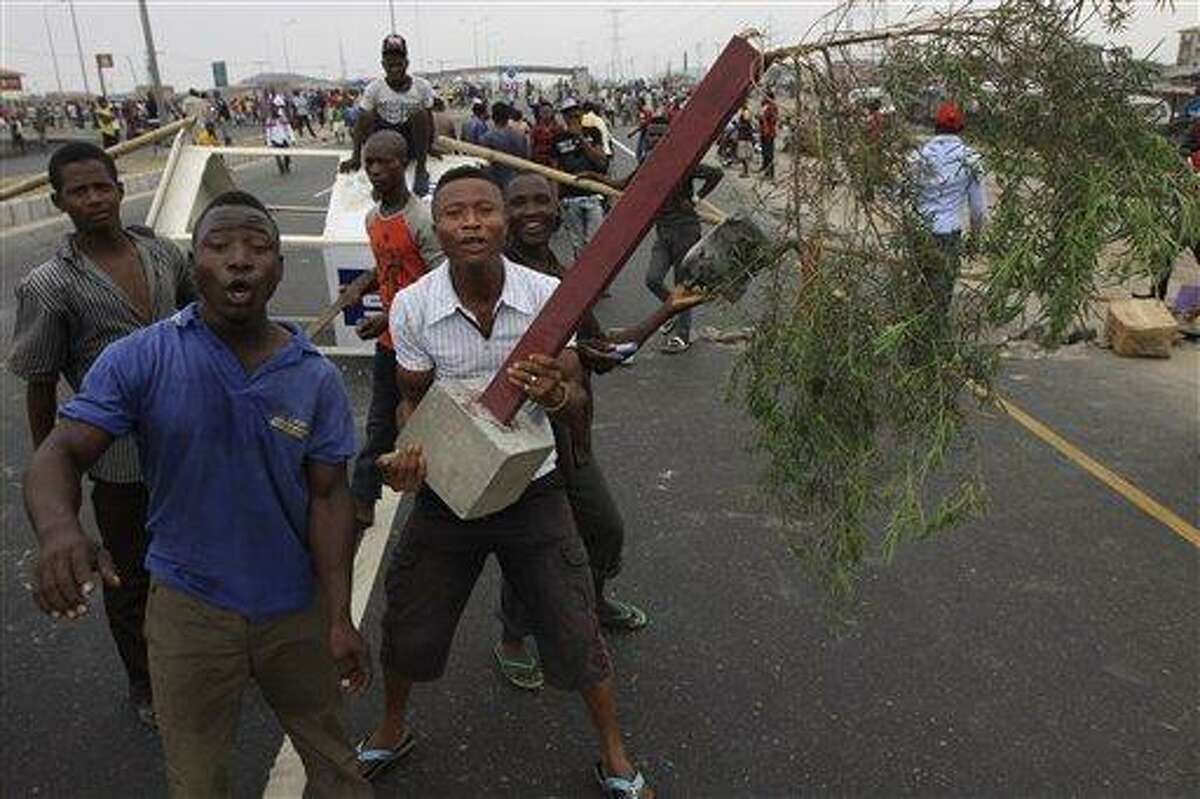 Angry youths protest on a Lekki road on the third day of a nationwide strike following the removal of a fuel subsidy by the government in Lagos, Nigeria. Associated Press