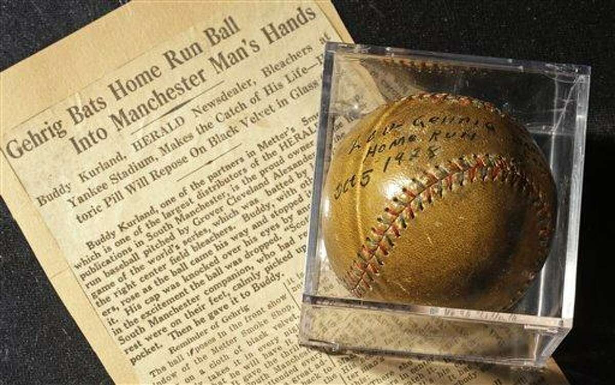 A baseball that New York Yankees slugger Lou Gehrig hit for a World Series home run in 1928 is on display at a convention center in Kansas City, Mo., Thursday, July 5, 2012. Stamford, Conn., resident Elizabeth Gott, is selling the baseball at auction on behalf of her 30-year-old son, Michael to help pay off his medical school debts. (AP Photo/Charlie Riedel)