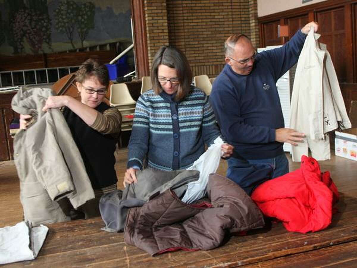 Dispatch Staff Photo by JOHN HAEGER twitter.com/oneidaphoto Deb Brewer, Bambi Niles and Jim Tuggey sort coats for the upcoming coat give away on Friday, Nov. 2, 2012 at the First United Methodist Church in Oneida.
