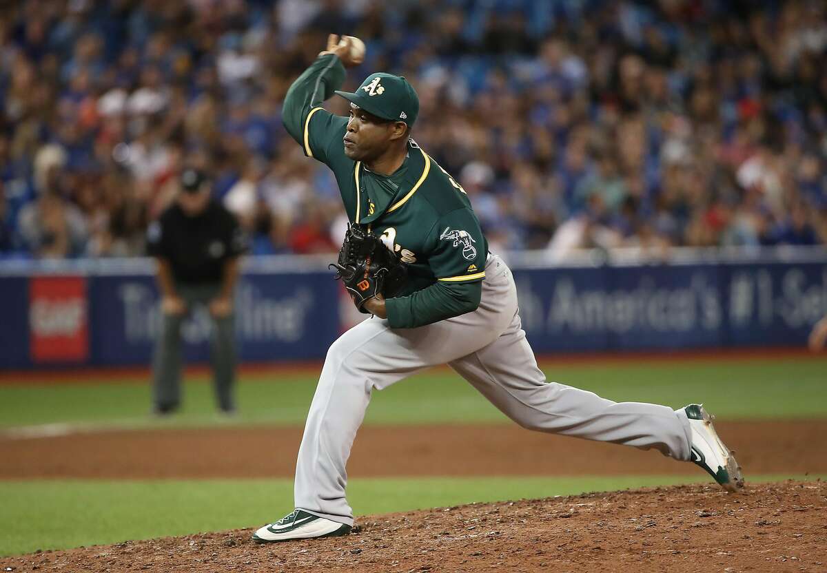 TORONTO, ON - JULY 26: Santiago Casilla #46 of the Oakland Athletics delivers a pitch in the ninth inning during MLB game action against the Toronto Blue Jays at Rogers Centre on July 26, 2017 in Toronto, Canada. (Photo by Tom Szczerbowski/Getty Images)