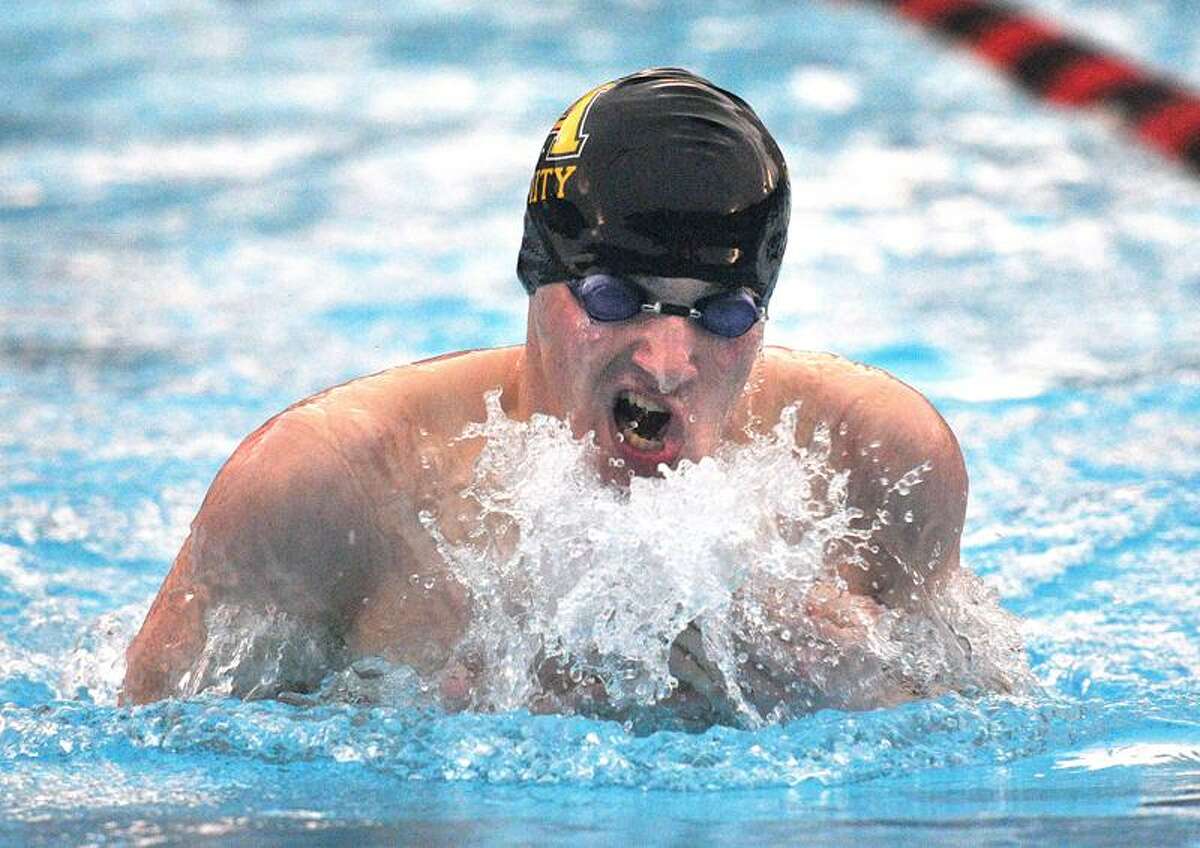 Cheshire-- Amity's Eric Holden on his way to a win during the breast stroke in the 200 IM Medley . Photo- Peter Casolino/New Haven Register 03/01/12
