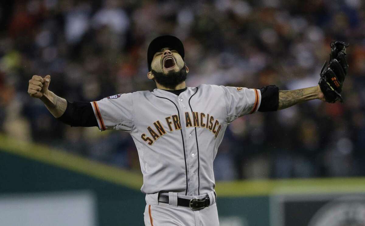 San Francisco Giants' Sergio Romo reacts after striking out Detroit Tigers' Miguel Cabrera in the 10th inning of Game 4 of baseball's World Series Sunday, Oct. 28, 2012, in Detroit. The Giants won the game 4-3 to win the World Series. (AP Photo/Matt Slocum)