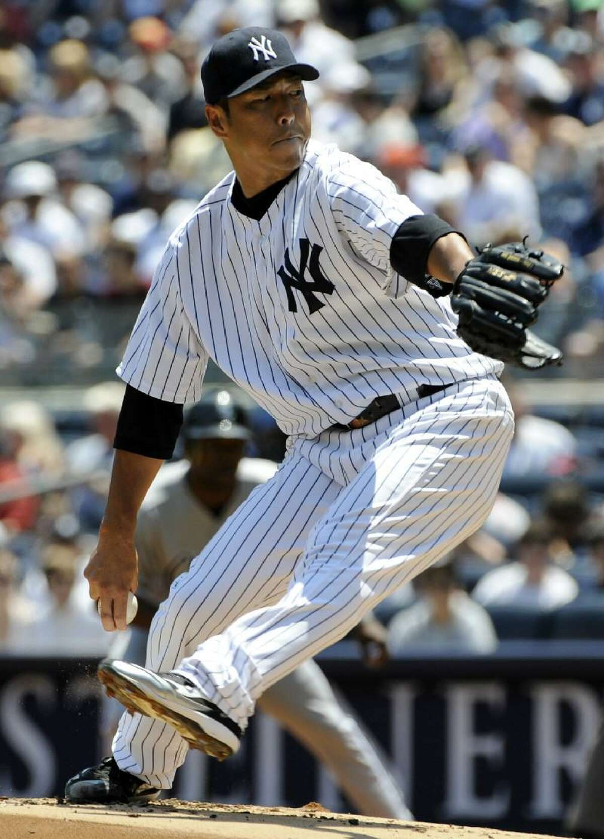 ASSOCIATED PRESS New York Yankees starter Hiroki Kuroda delivers a pitch to the Chicago White Sox during the first inning of Saturday's game at Yankee Stadium in New York. Kuroda struck out 11 and got the win as the Yankees defeated the White Sox 4-0.