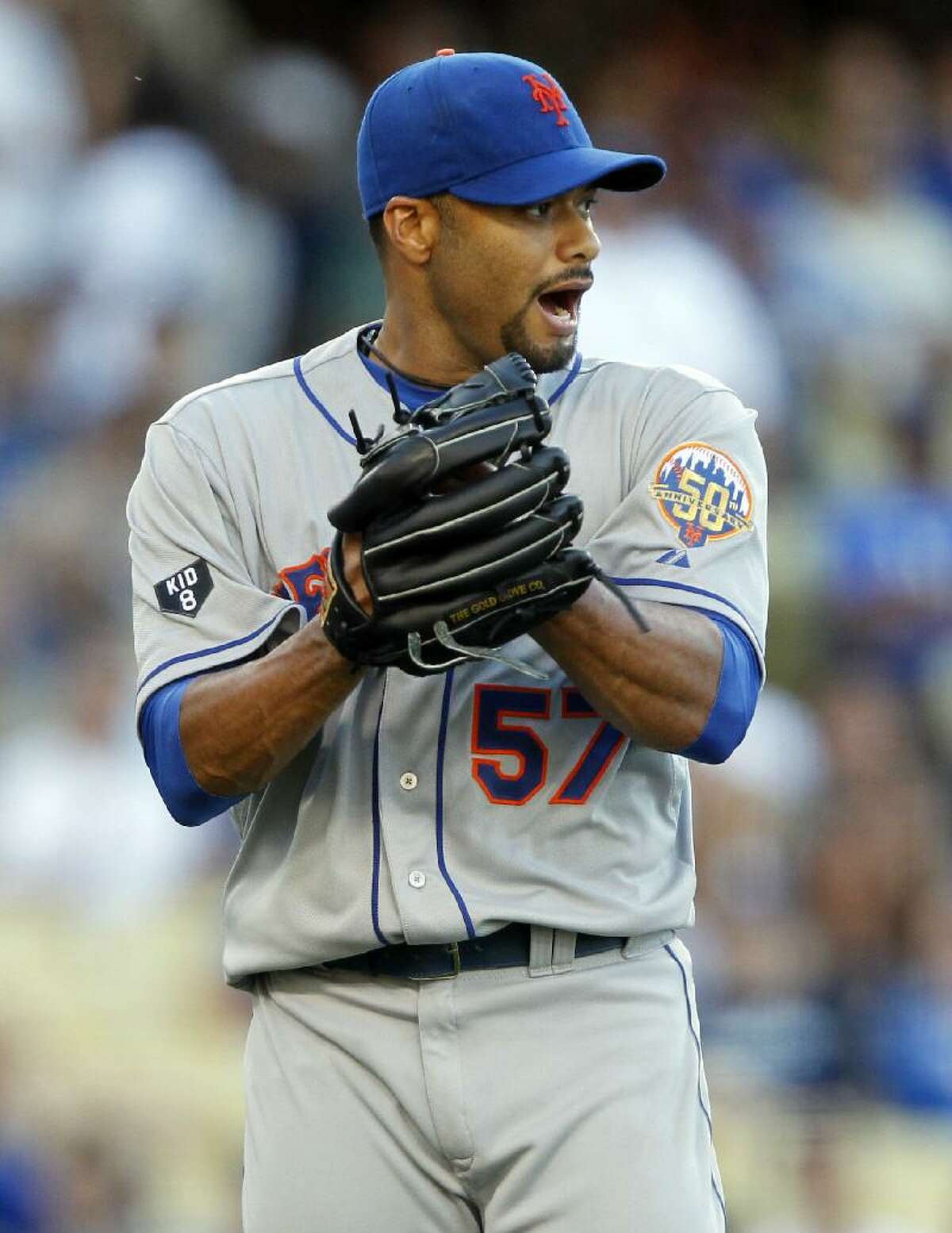 ASSOCIATED PRESS New York Mets starting pitcher Johan Santana (57) lets out a yell after Los Angeles Dodgers' Dee Gordon (not pictured) grounds out to end the eighth inning of Saturday's game in Los Angeles. The Mets won 5-0.
