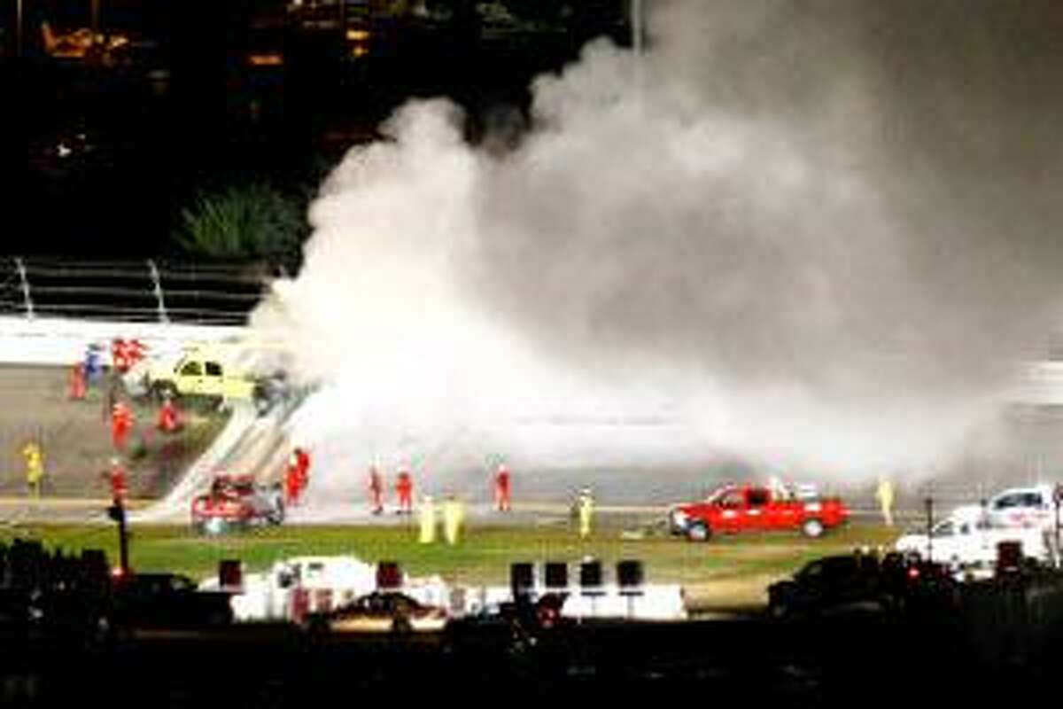 ASSOCIATED PRESS A track jet dryer burns after a collision with the car of Juan Pablo Montoya (42) during the Daytona 500 auto race in Daytona Beach, Fla., Monday.