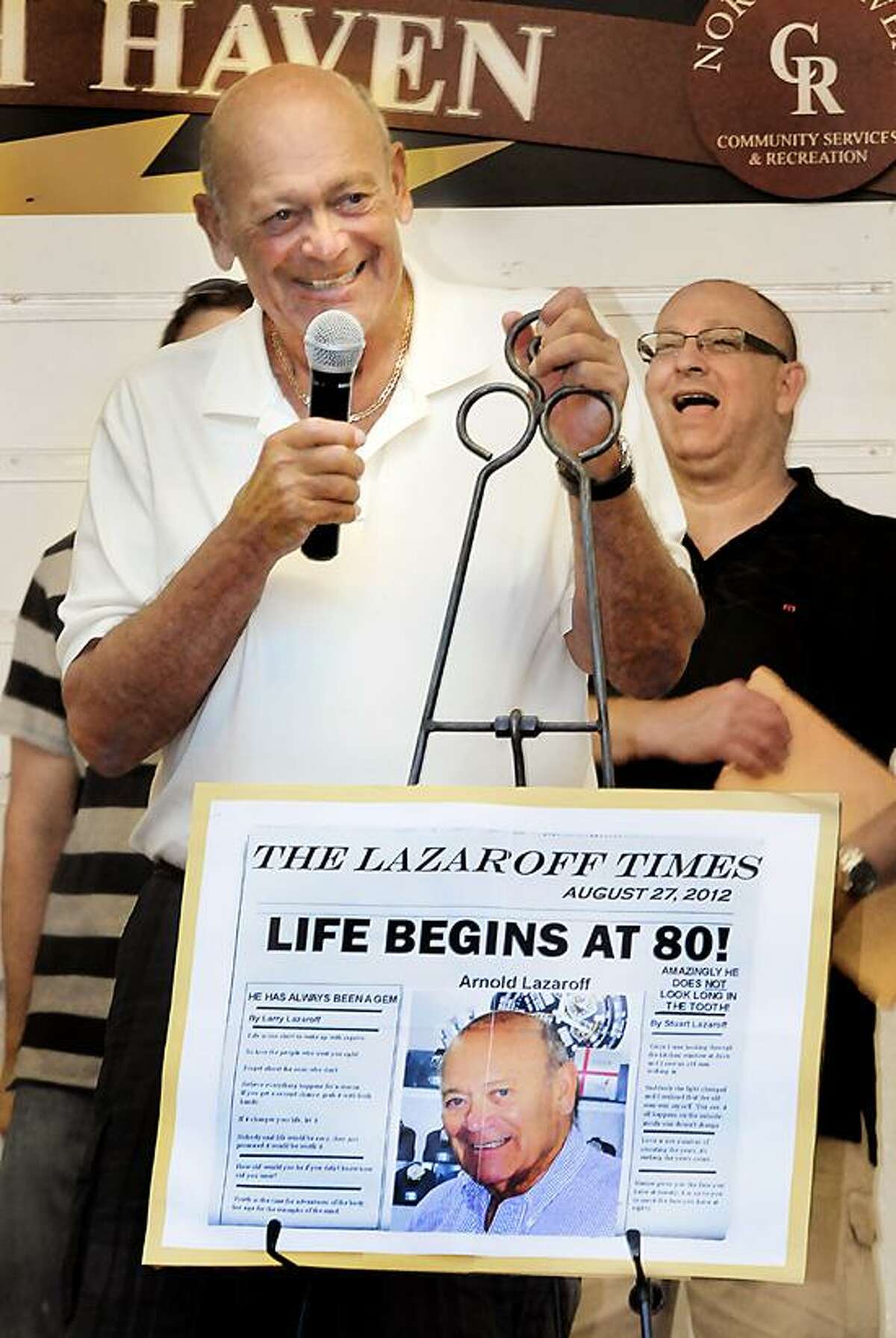 Arnold Lazaroff thanks those gathered on the Green for joining him in his 80th birthday celebration. Melanie Stengel/Register