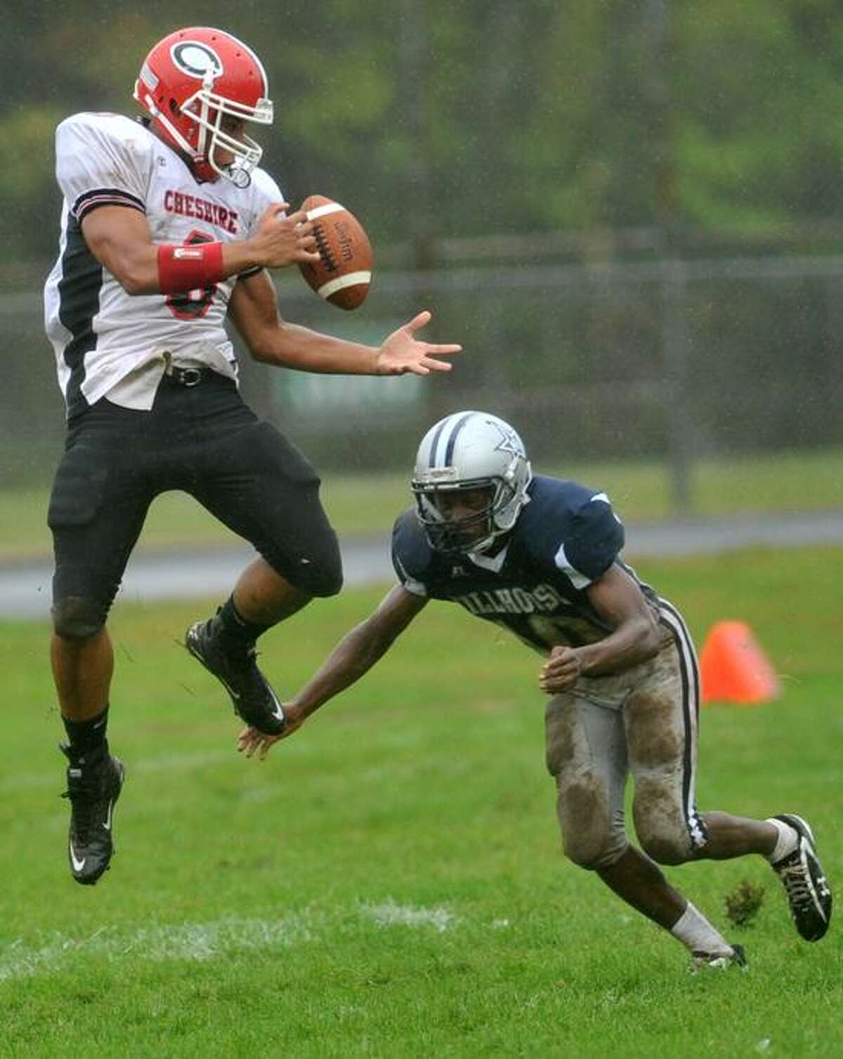 Cheshire's Sebastian Little, here defended by Hillhouse's Je'Vaughn Moore during a game in September, will lead a talented, and smart, group of Connecticut footballers as they take on Rhode Island in the 14th Governors' Cup game Saturday. (Peter Hvizdak/Register file photo)