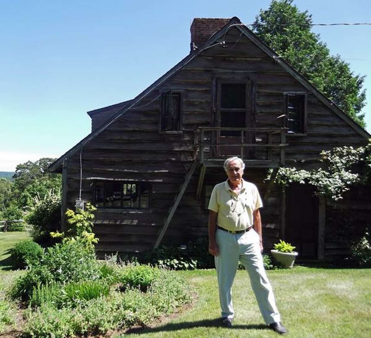 MICHELLE MERLIN/Register Citizen Litchfield author and retired journalist Thomas "Dennie" Williams at his family home in Litchfield.