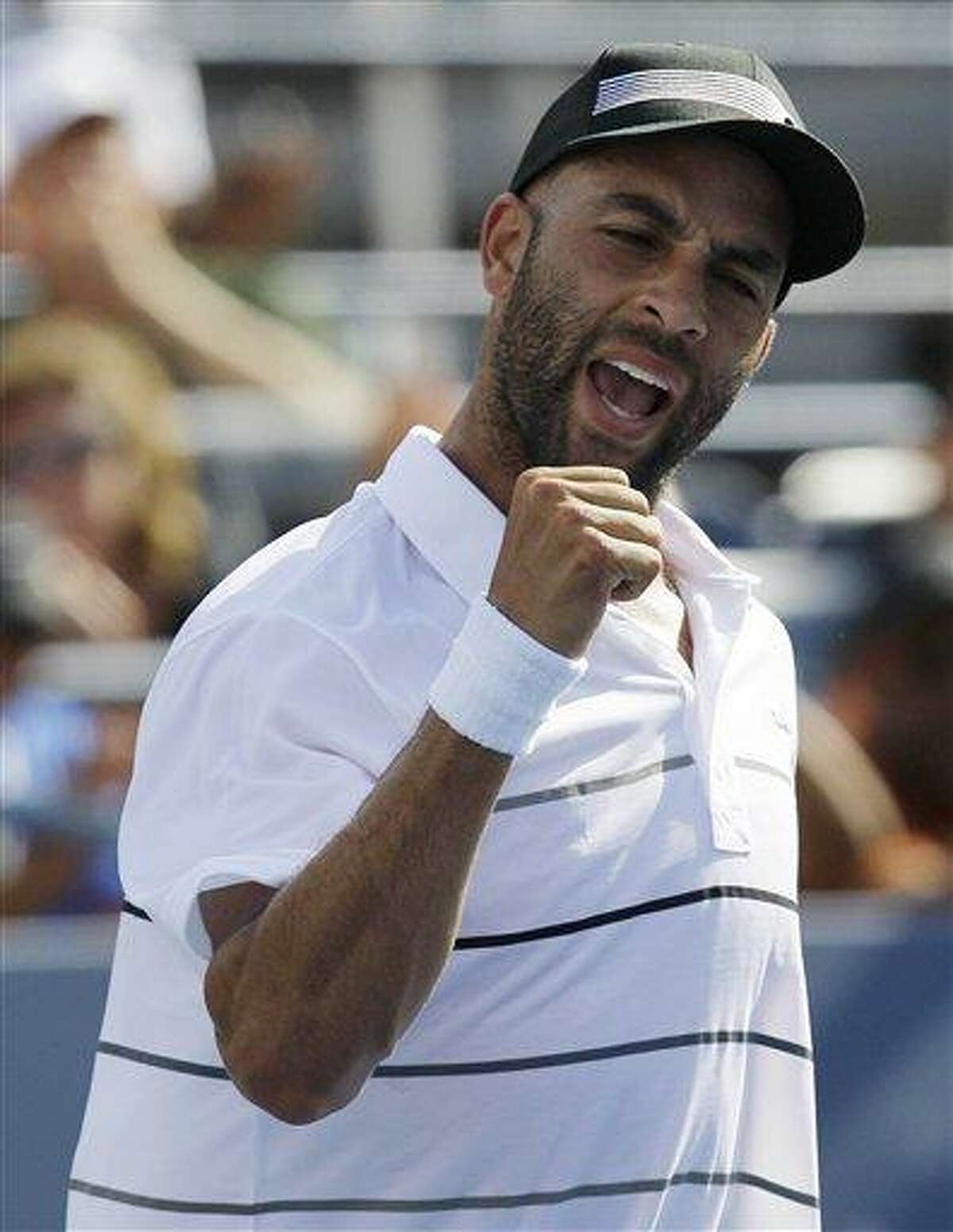 James Blake reacts after winning his match against Lukas Lacko, of Slovakia, in the first round of play at the 2012 US Open Tennis tournament, Monday, Aug. 27, 2012, in New York. (AP Photo/Kathy Willens)