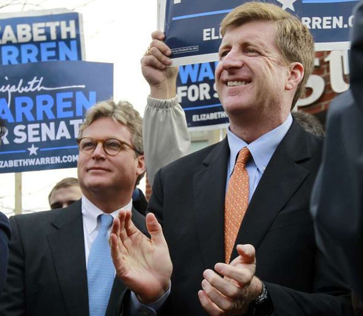 Edward M. Kennedy, Jr., left, and former U.S. Rep. Patrick Kennedy, D-R.I., right, both sons of the late U.S. Sen. Edward M. Kennedy, D-Mass., attend a campaign event for Democratic candidate for the U.S. Senate Elizabeth Warren, not shown, in the Dorchester neighborhood of Boston Monday, Nov. 5, 2012. Both Warren and incumbent U.S. Sen. Scott Brown, R-Mass., continue their push around the state on the final day of campaigning before Election Day. (AP Photo/Steven Senne)