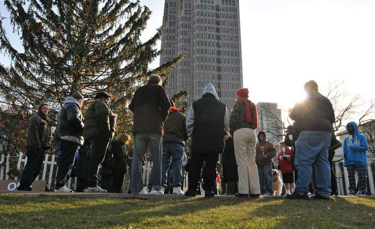 New Haven-- Members of the mental health community pray during a vigil on the New Haven Green remembering the Sandy Hook shooting victims. Photo-Peter Casolino 12/24/12,