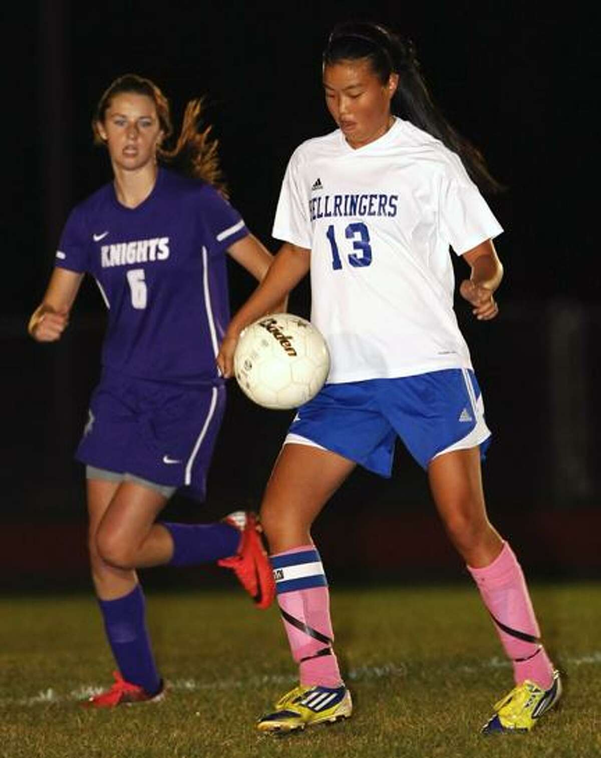 Special to the Press 10.25.12 East Hampton's Renee Radavich battles Westbrook's Casey Abraham in Thursday night's girls' soccer game. East Hampton led, 3-1 late in the game. To buy a glossy print of this photo and more, visit www.middletownpress.com.
