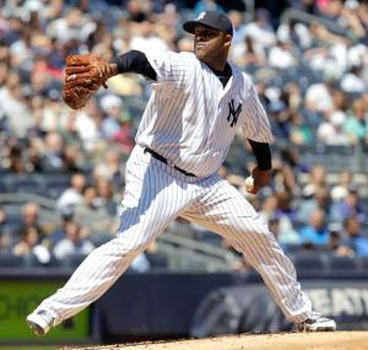 ASSOCIATED PRESS New York Yankees starting pitcher CC Sabathia winds up during the second inning of Sunday's game against the Detroit Tigers at Yankee Stadium in New York. The Yankees won the game 6-2.