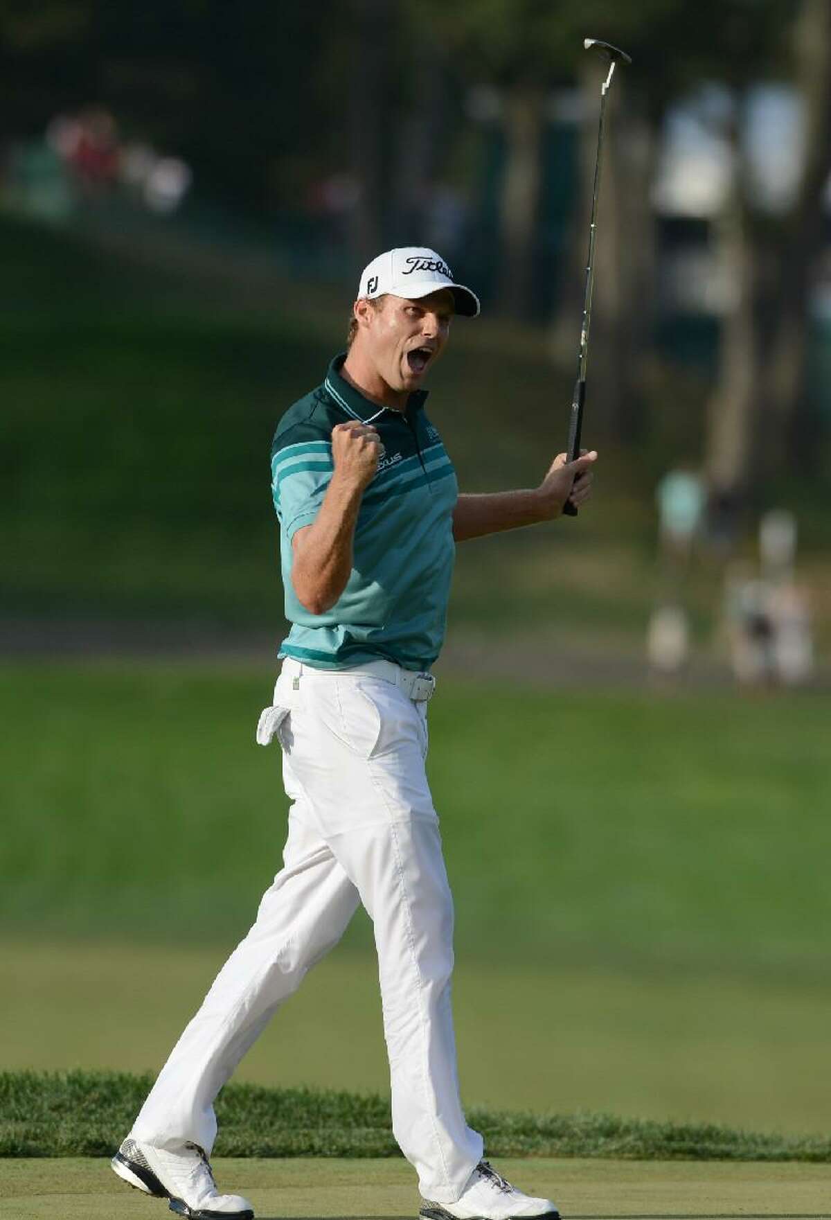 ASSOCIATED PRESS Nick Watney celebrates after sinking a birdie putt on the 18th hole of the fourth round and winning The Barclays golf tournament at Bethpage State Park in Farmingdale, N.Y., Sunday.
