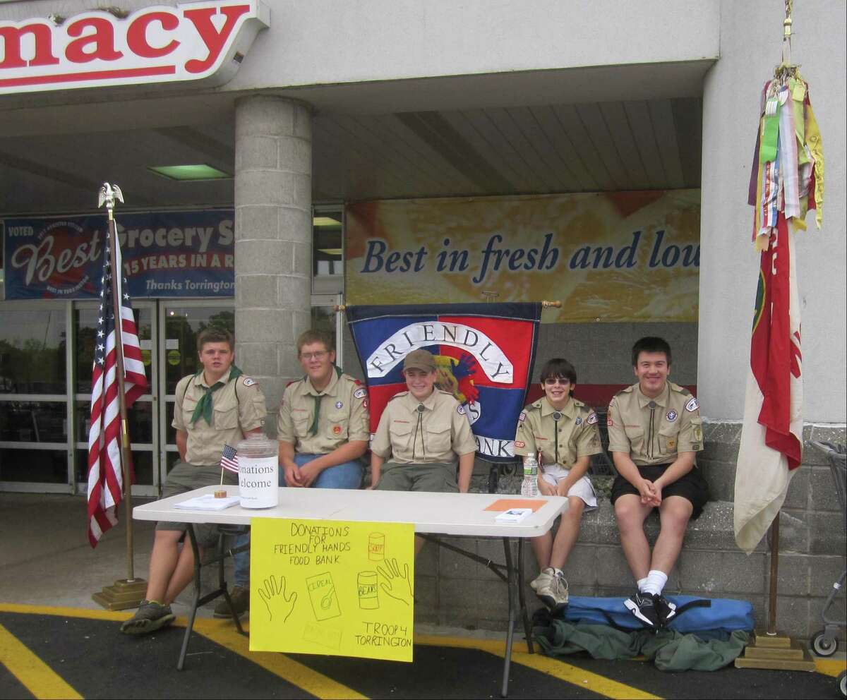 Submitted photo Boy Scouts from Troop 4 in Torrington, from left, Taylor Yurgalevicz, Logan Connor, Stephen Torlai, Christopher Sykes and Matthew White collect food and monetary donations at Price Chopper in Torrington to support the Friendly Hands Food Bank.