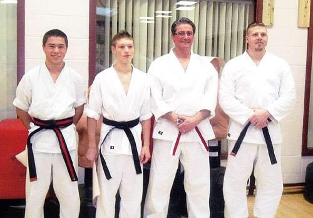 Photo Courtesy AUGUSTINE'S MARTIAL ARTS From left are Zach Smith, Dan Keck, Sensei Roy Augustine and Josh Lindemann.